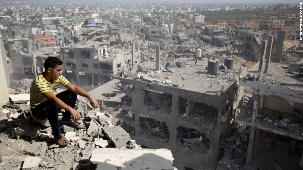 Palestinian overlooking gaza destroyed